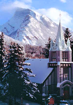 St. Paul's Church with a snow-capped Mt. Rundle in the Canadian Rockies' Banff National Park.