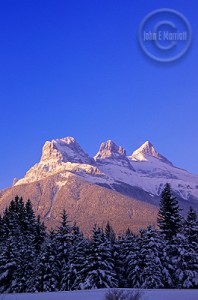 can0044_threesisters_canmorealberta_filtered Shot of the Three Sisters Mountains. Photo by John E. Marriott
